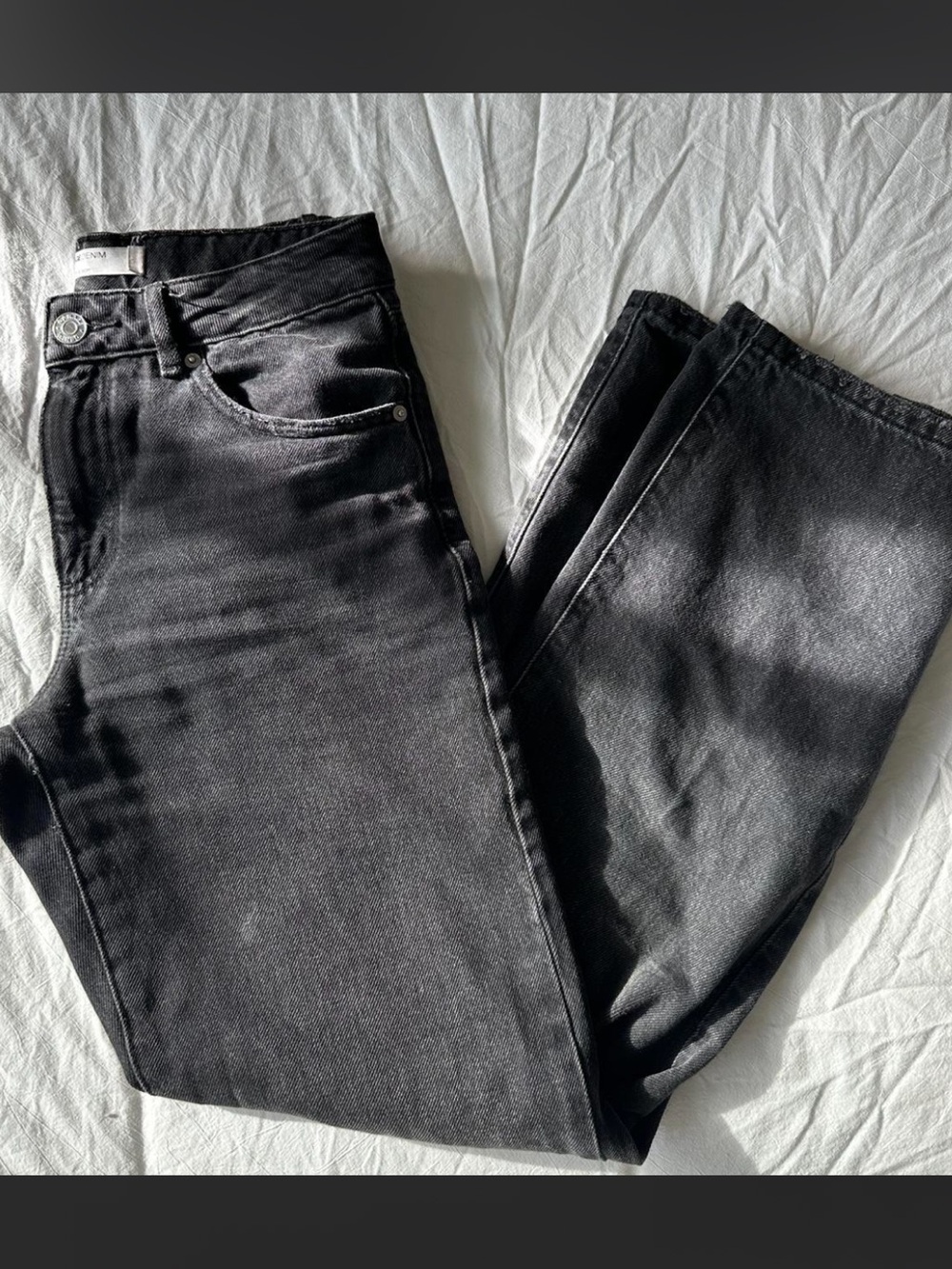 Women’s Garage black straight jeans with minimal distressing.